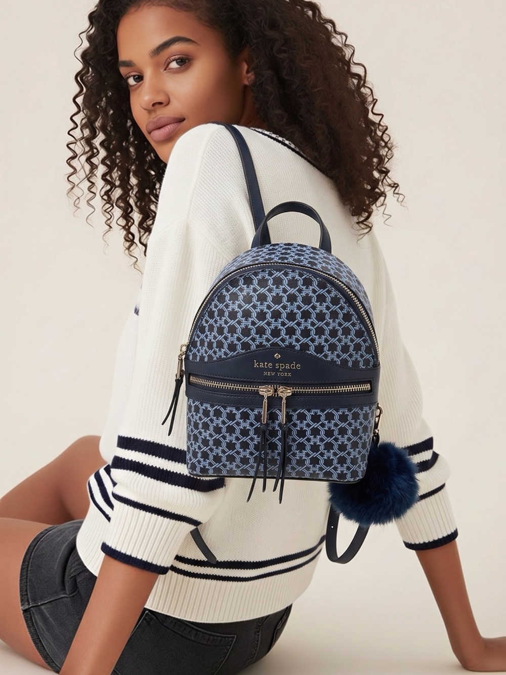 kate spade navy patterned mini backpack with pom charm NWT